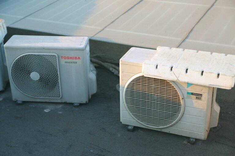 a couple of air conditioners sitting next to each other